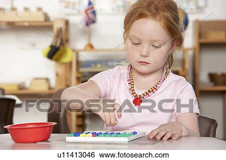 Young Boy Playing at Montessori/Pre-School View Large Photo Image Stock Photograph - Young Boy Playing at Montessori/Pre-School. Fotosearch