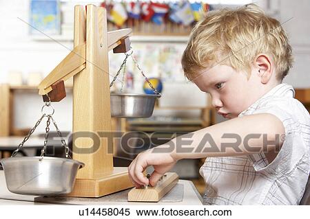 Stock Photography - Young Boy Playing at Montessori/Pre-School. Fotosearch