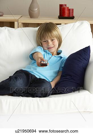 Picture - Young Boy Watching Television at Home. Fotosearch