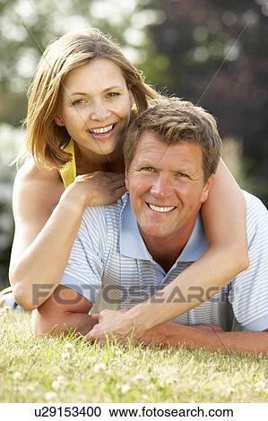 Young couple having fun in countryside View Large Photo Image Stock Image - Young couple having fun in countryside. Fotosearch