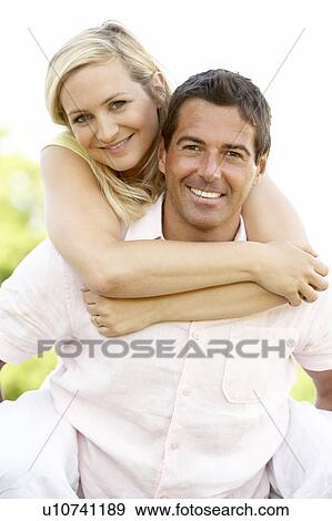Young couple having fun in countryside View Large Photo Image Stock Photo - Young couple having fun in countryside. Fotosearch