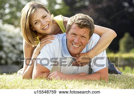 Young couple having fun in countryside View Large Photo Image Stock Photo - Young couple having fun in countryside. Fotosearch
