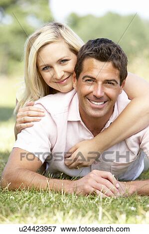 Stock Photo - Young couple having fun in countryside. Fotosearch
