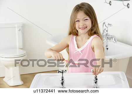 Young Girl Brushing Teeth at Sink View Large Photo Image Stock Image - Young Girl Brushing Teeth at Sink. Fotosearch