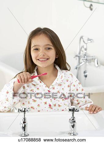 Young Girl Brushing Teeth at Sink View Large Photo Image Stock Photo - Young Girl Brushing Teeth at Sink. Fotosearch