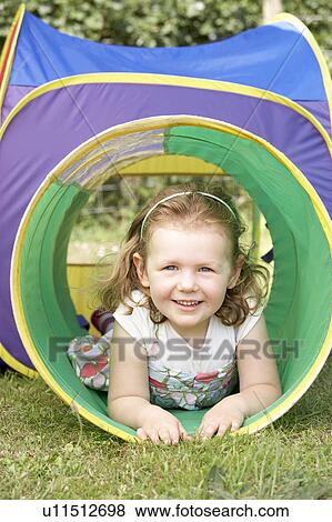 Young Girl Crawling Through Play Equipment View Large Photo Image Stock Photo - Young Girl Crawling Through Play Equipment. Fotosearch