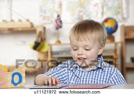 Young Girl Playing at Montessori/Pre-School View Large Photo Image Stock Image - Young Girl Playing at Montessori/Pre-School. Fotosearch