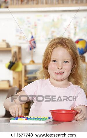 Young Girl Playing at Montessori/Pre-School View Large Photo Image Stock Image - Young Girl Playing at Montessori/Pre-School. Fotosearch