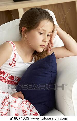 Young Girl Sat on Sofa at Home View Large Photo Image Stock Image - Young Girl Sat on Sofa at Home. Fotosearch