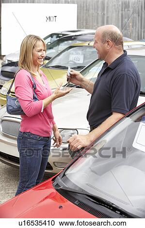 Young woman collecting new car View Large Photo Image Stock Image - Young woman collecting new car. Fotosearch