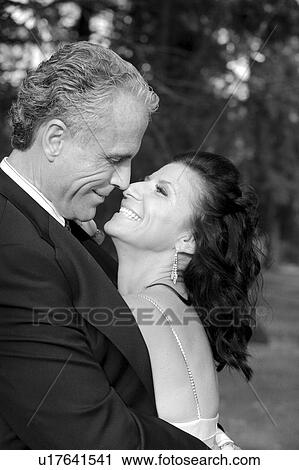 Stock Image - Bride and groom hugging. Fotosearch