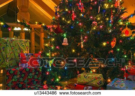Stock Photograph - Christmas tree and gifts. Fotosearch