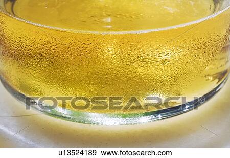 Condensation on glass of beer View Large Photo Image Stock Photo - Condensation on glass of beer. Fotosearch