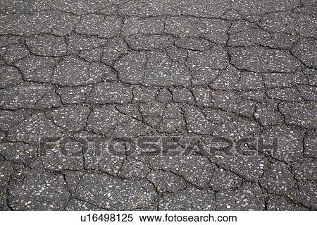 Cracked asphalt pavement; Montreal, Quebec, Canada View Large Photo Image Stock Photography - Cracked asphalt pavement; Montreal, Quebec, Canada. Fotosearch