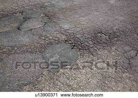 Cracked asphalt pavement View Large Photo Image Stock Image - Cracked asphalt pavement. Fotosearch