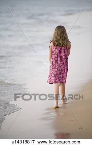 Girl walking on beach, Maui, Hawaii, USA View Large Photo Image Stock Photo - Girl walking on beach, Maui, Hawaii, USA. Fotosearch