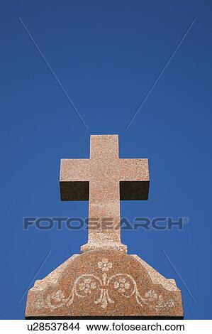 Granite cross on top of a Headstone in a cemetery, Laval, Quebec, Canada View Large Photo Image Picture - Granite cross on top of a Headstone in a cemetery, Laval, Quebec, Canada. Fotosearch