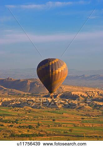 Hot air balloon over Goreme valley, Cappadocia, Anatolia, Turkey View Large Photo Image Stock Photo - Hot air balloon over Goreme valley, Cappadocia, Anatolia, Turkey. Fotosearch