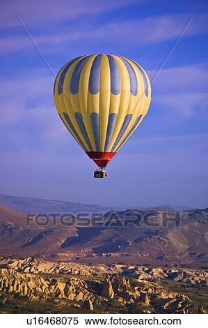 Hot air balloon over Goreme valley, Cappadocia, Anatolia, Turkey View Large Photo Image Stock Photography - Hot air balloon over Goreme valley, Cappadocia, Anatolia, Turkey. Fotosearch