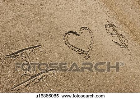Stock Photography - I love money written in sand. Fotosearch
