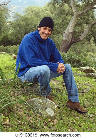 Stock Photography - Portrait of man in the woods. Fotosearch