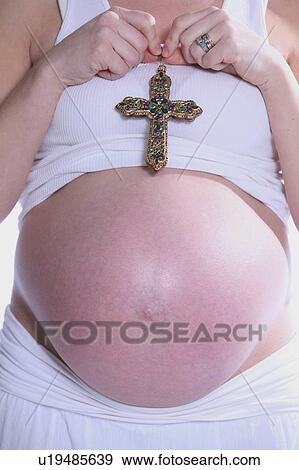 Stock Photo - Praying for baby. Fotosearch