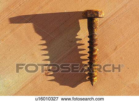 Rusty screw with shadow View Large Photo Image Stock Photo - Rusty screw with shadow. Fotosearch