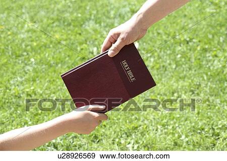 Sharing the Bible View Large Photo Image Stock Photo - Sharing the Bible. Fotosearch
