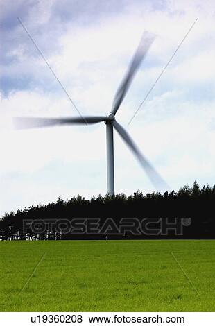Wind turbine behind a field of grass, North Yorkshire, England View Large Photo Image Stock Photo - Wind turbine behind a field of grass, North Yorkshire, England. Fotosearch