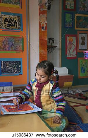 Stock Photo - A little girl painting. Fotosearch