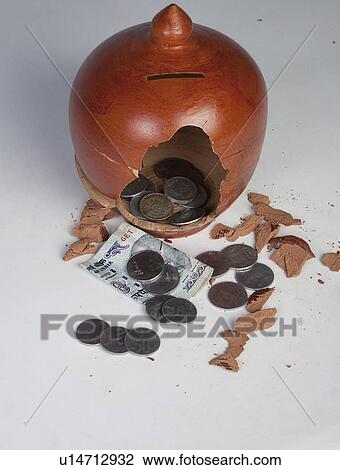 Stock Image - Broken piggy bank. Fotosearch