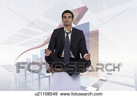 Businessman meditating View Large Photo Image Stock Photo - Businessman meditating. Fotosearch
