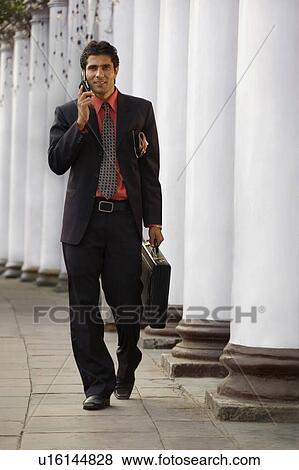 Stock Photo - Businessman talking on the mobile phone. Fotosearch