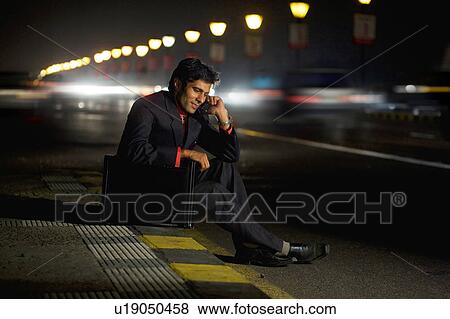 Stock Photo - Businessman talking on the phone. Fotosearch