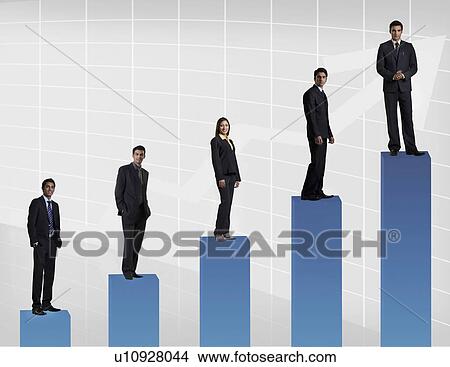 Businesspeople standing on a graph View Large Photo Image Picture - Businesspeople standing on a graph. Fotosearch