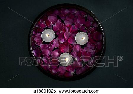 Candles with flower petals View Large Photo Image Stock Photography - Candles with flower petals. Fotosearch