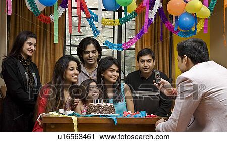 Stock Image - Celebrating a birthday. Fotosearch