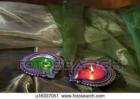 Stock Image - Colourful diyas. Fotosearch