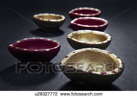 Stock Image - Colourful diyas. Fotosearch