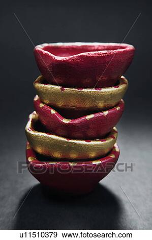 Stock Photo - Colourful diyas. Fotosearch
