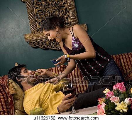 Stock Image - Couple enjoying a drink. Fotosearch