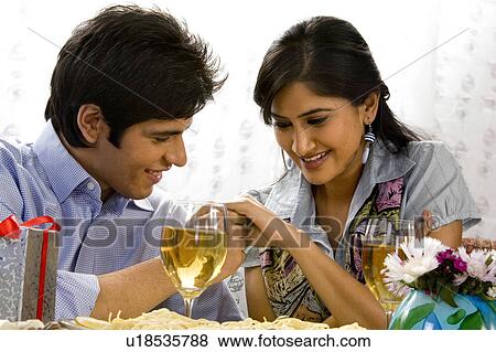 Couple enjoying a drink View Large Photo Image Stock Photo - Couple enjoying a drink. Fotosearch