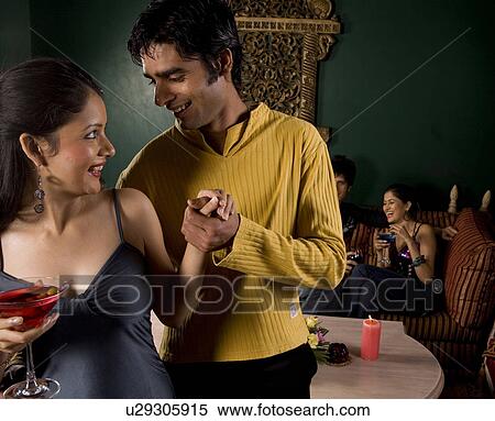 Couple enjoying a drink View Large Photo Image Stock Photography - Couple enjoying a drink . Fotosearch