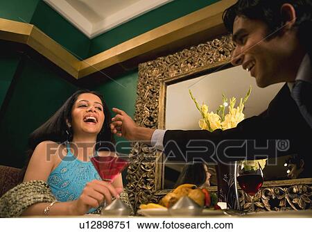 Couple enjoying a meal View Large Photo Image Stock Image - Couple enjoying a meal. Fotosearch