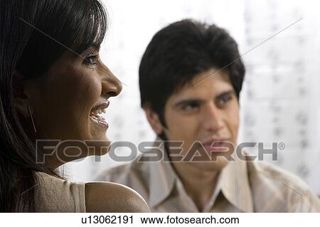 Stock Image - Couple enjoying a meal. Fotosearch