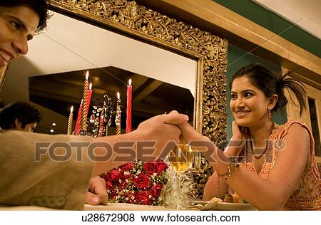 Stock Photo - Couple enjoying a meal. Fotosearch