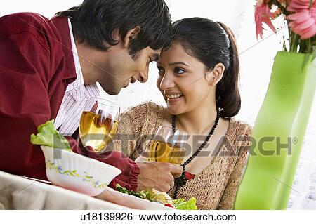 Stock Photograph - Couple enjoying a meal. Fotosearch