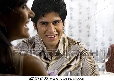 Stock Photography - Couple enjoying a meal. Fotosearch