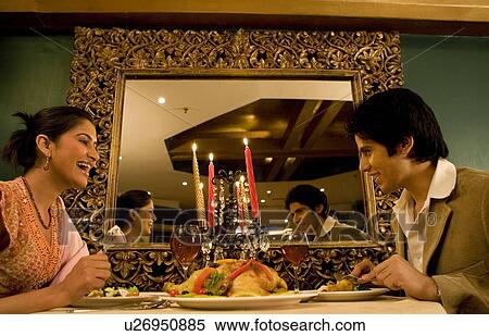 Couple enjoying a meal View Large Photo Image Stock Photography - Couple enjoying a meal. Fotosearch