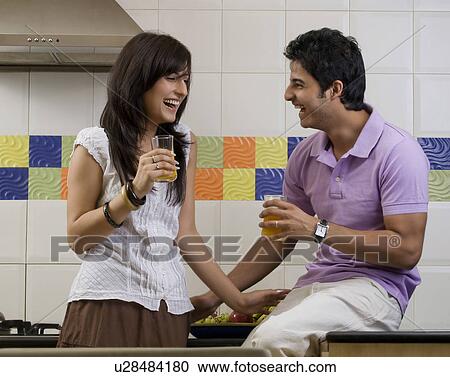 Couple enjoying themselves View Large Photo Image Stock Image - Couple enjoying themselves. Fotosearch